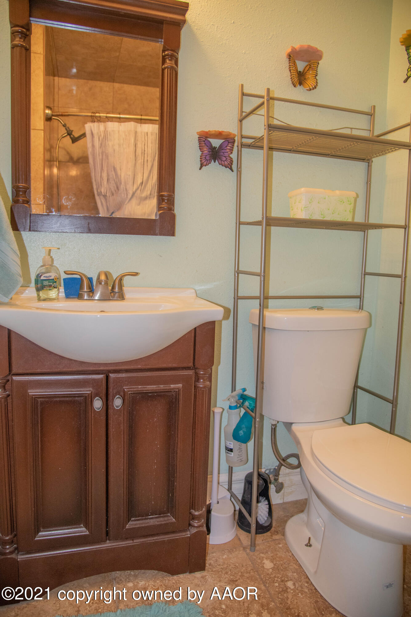 5101 South Austin Street Amarillo, TX 79110 - Photo 11 of 24 a bathroom with a sink a toilet and mirror