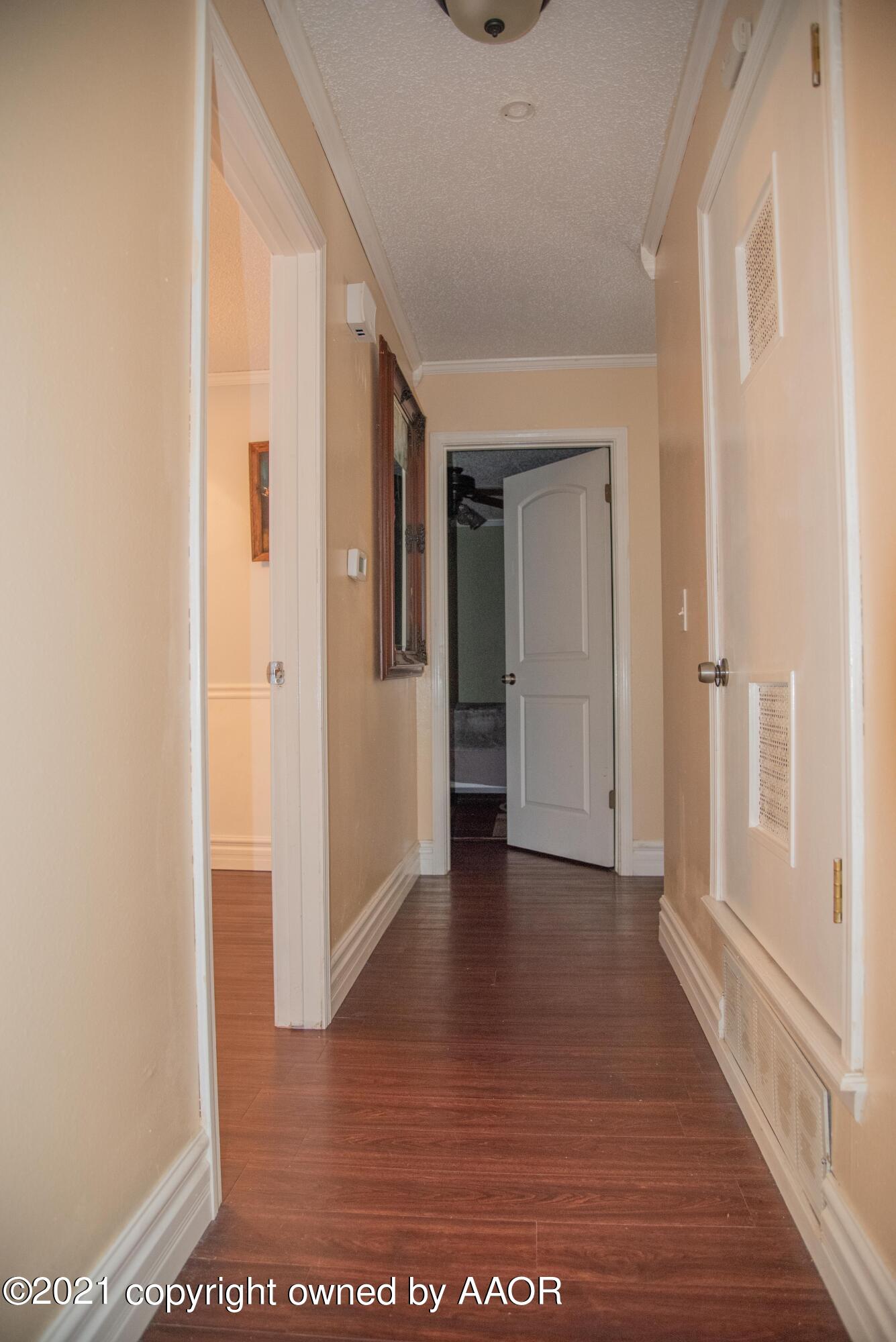 5101 South Austin Street Amarillo, TX 79110 - Photo 12 of 24 a view of a hallway with wooden floor