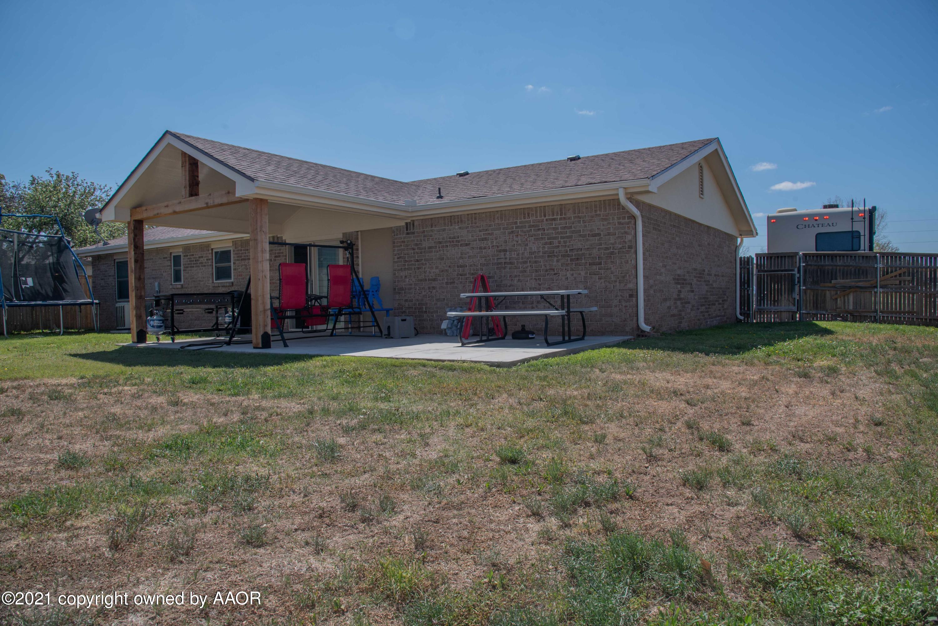 5101 South Austin Street Amarillo, TX 79110 - Photo 21 of 24 a view of a house with a yard