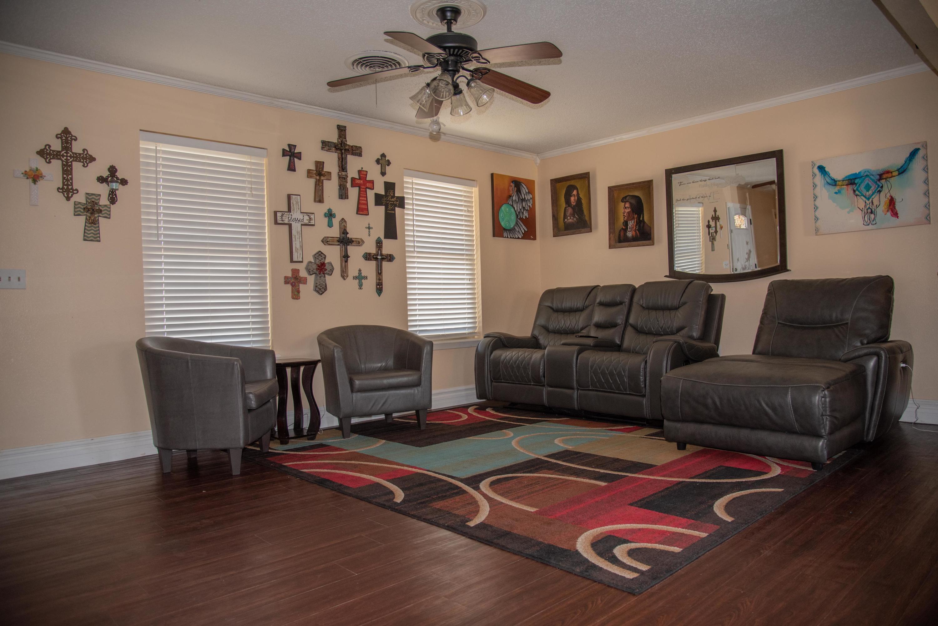 5101 South Austin Street Amarillo, TX 79110 - Photo 4 of 24 a living room with furniture and wooden floor