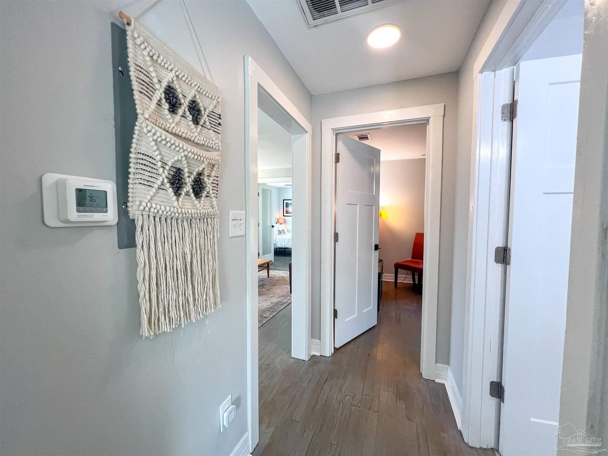 1315 Dexter Avenue Pensacola, FL 32507 - Photo 11 of 22 a view of a hallway with wooden floor