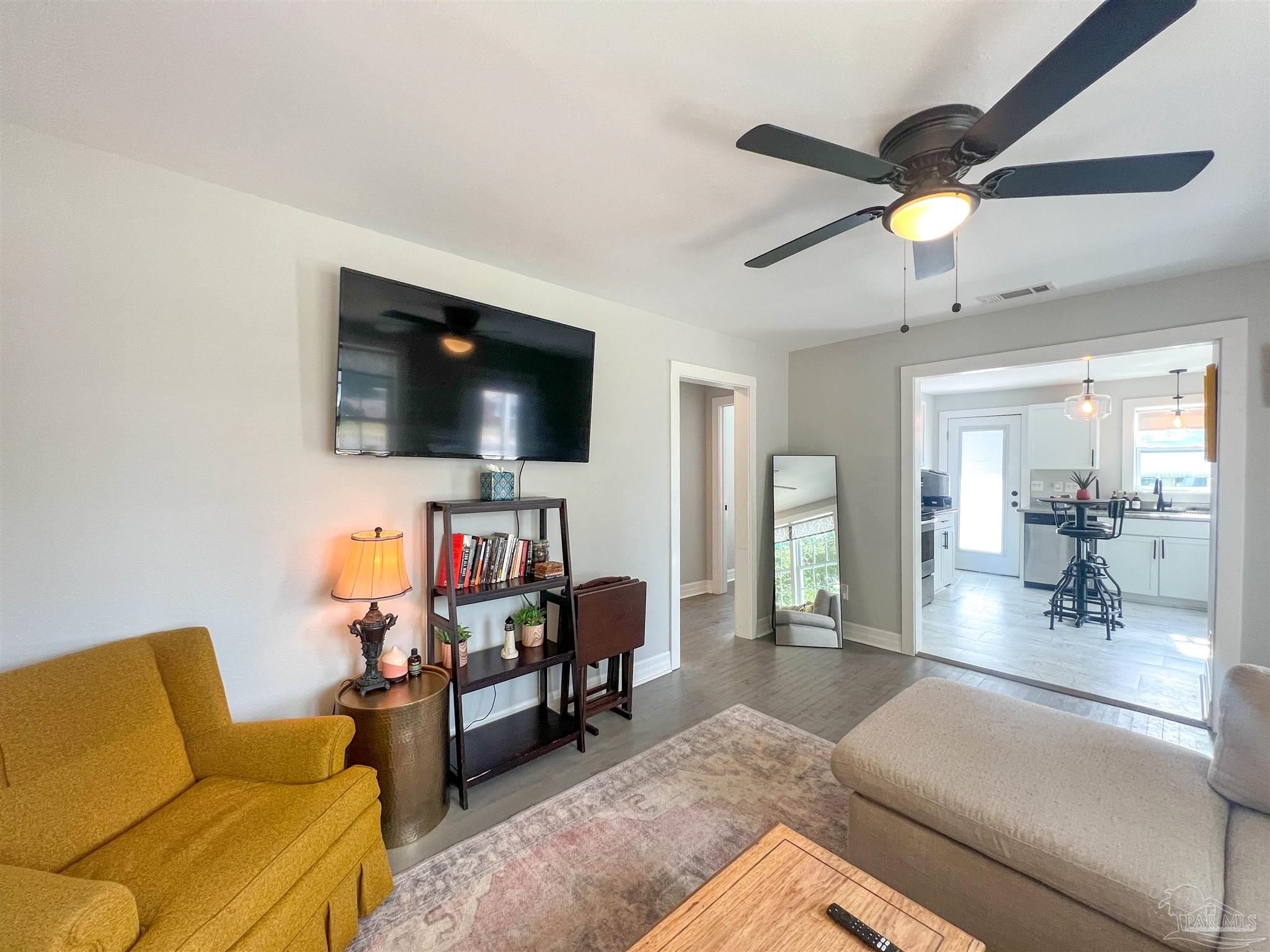 1315 Dexter Avenue Pensacola, FL 32507 - Photo 19 of 22 a living room with furniture and a flat screen tv
