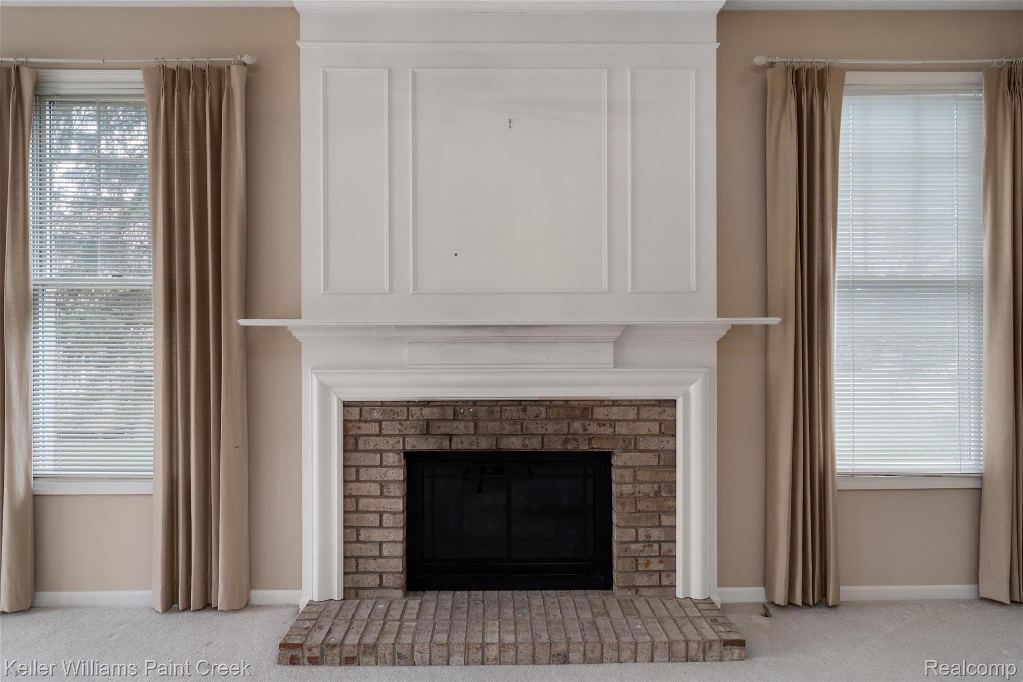 1685 Maple Creek Court Rochester, MI 48306 - Photo 3 of 49 Detailed view of carpet floors and a brick fireplace