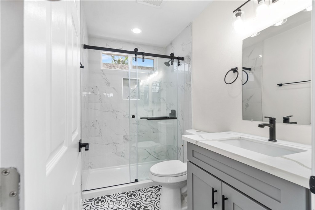 523 West 12th Street, Unit 2 San Pedro, CA 90731 - Photo 11 of 17 a bathroom with a sink toilet and shower