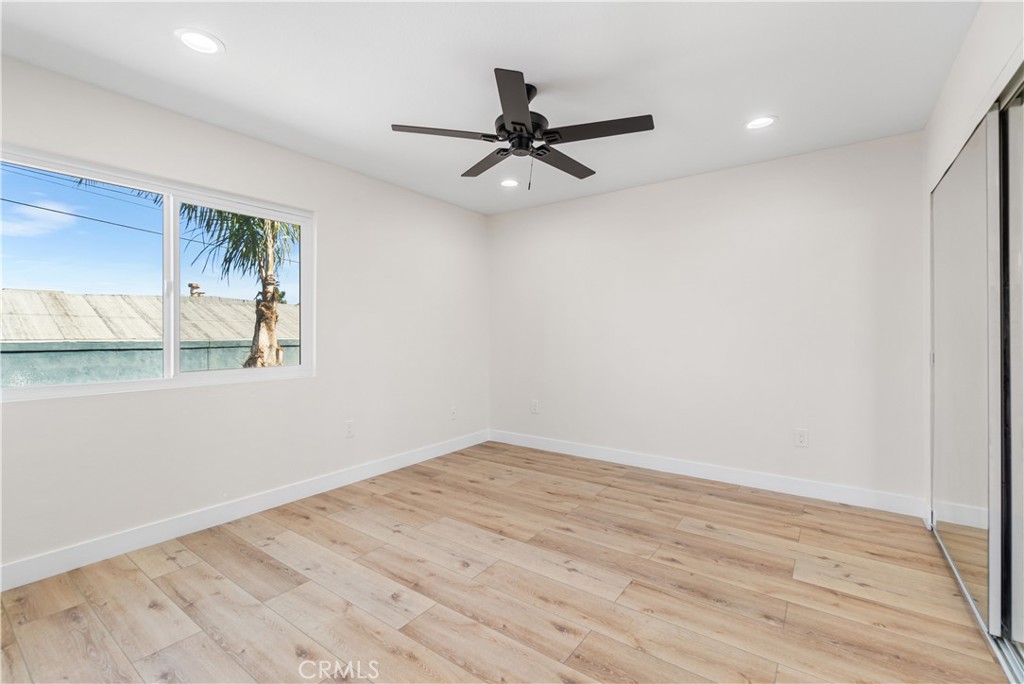 523 West 12th Street, Unit 2 San Pedro, CA 90731 - Photo 13 of 17 wooden floor in an empty room with a window