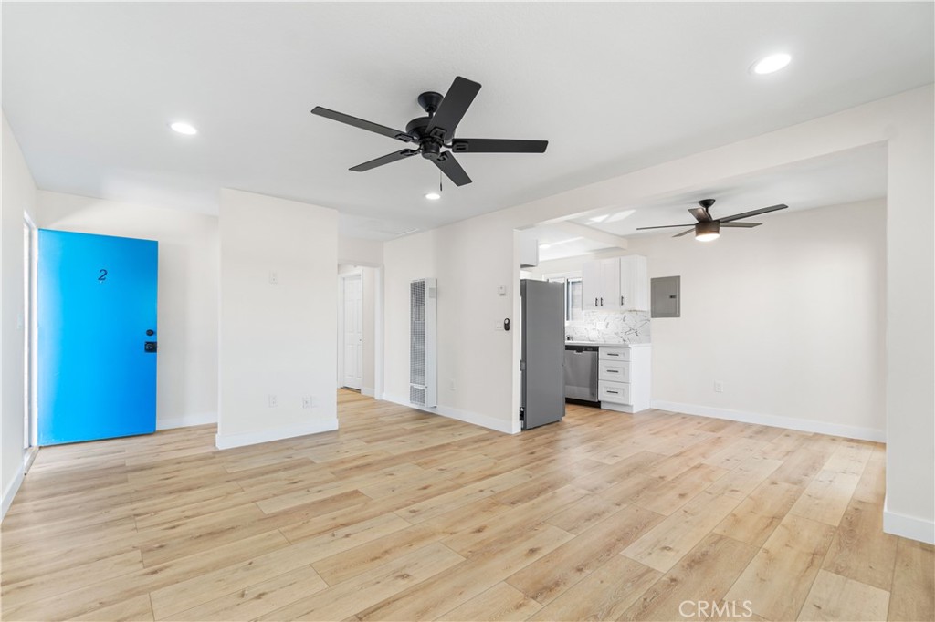 523 West 12th Street, Unit 2 San Pedro, CA 90731 - Photo 4 of 17 a view of empty room with wooden floor and ceiling fan