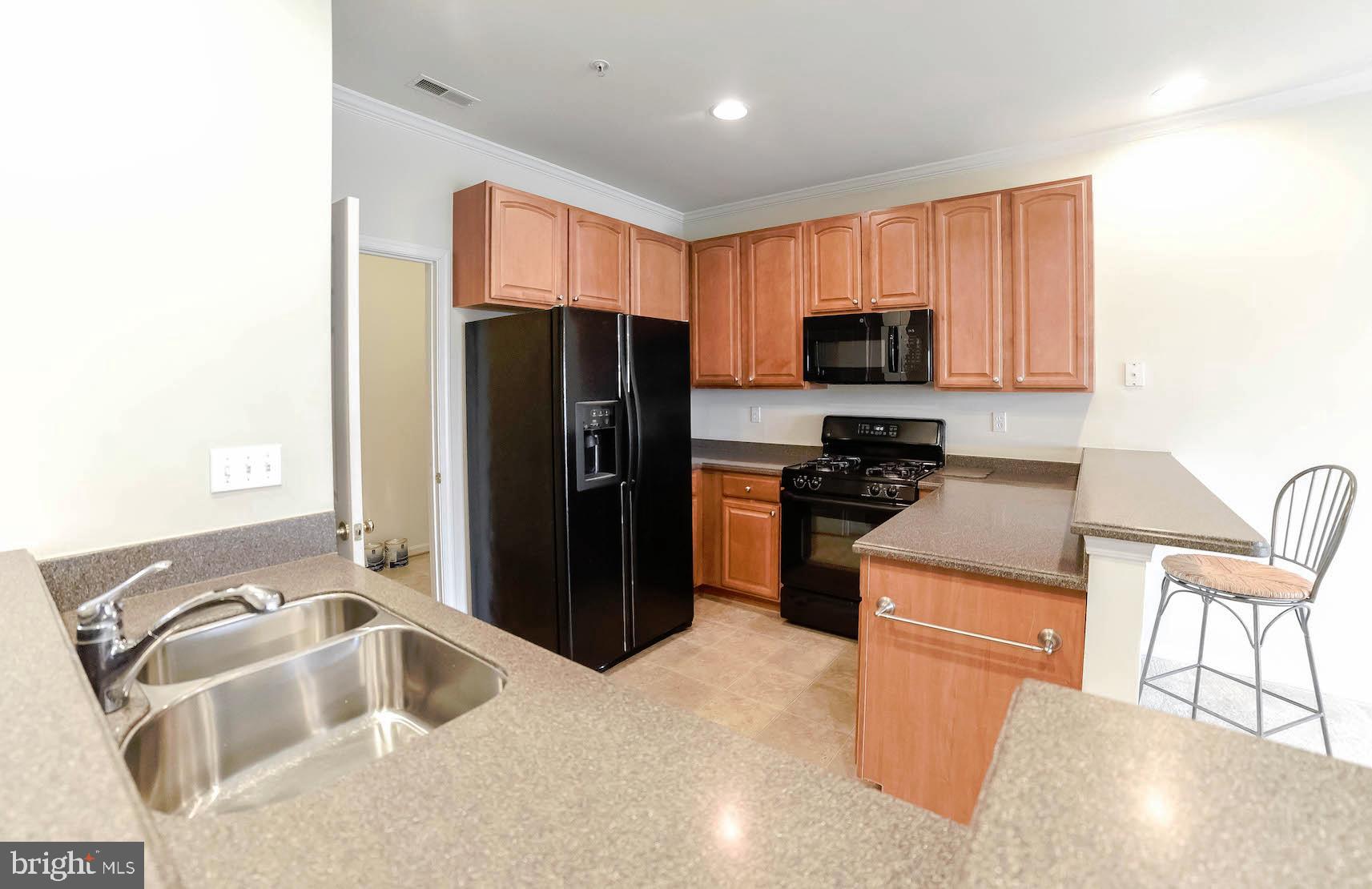 708 Ruxton Road, Unit 69 Solomons, MD 20629 - Photo 17 of 88 Spacious yet cozy kitchen. So easy to work in.