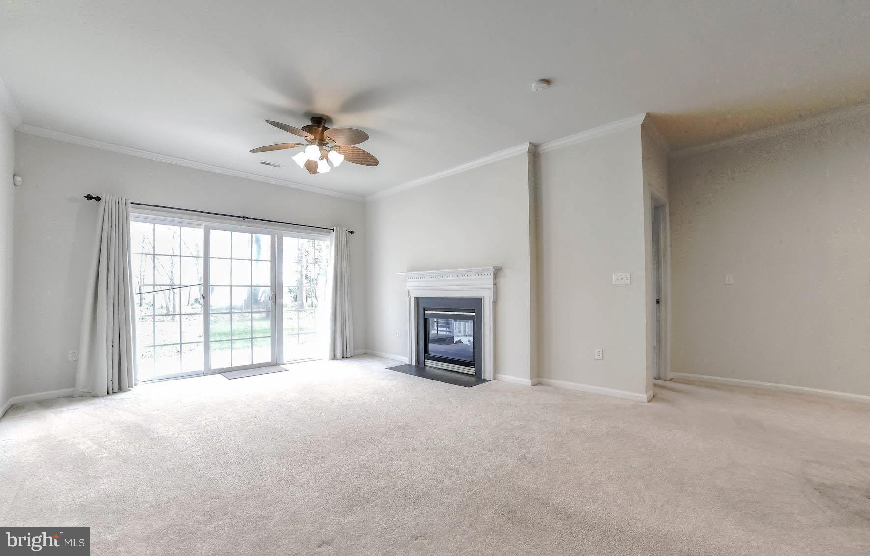 708 Ruxton Road, Unit 69 Solomons, MD 20629 - Photo 26 of 88 Large Living Room with dual-sided Gas Fire Place.