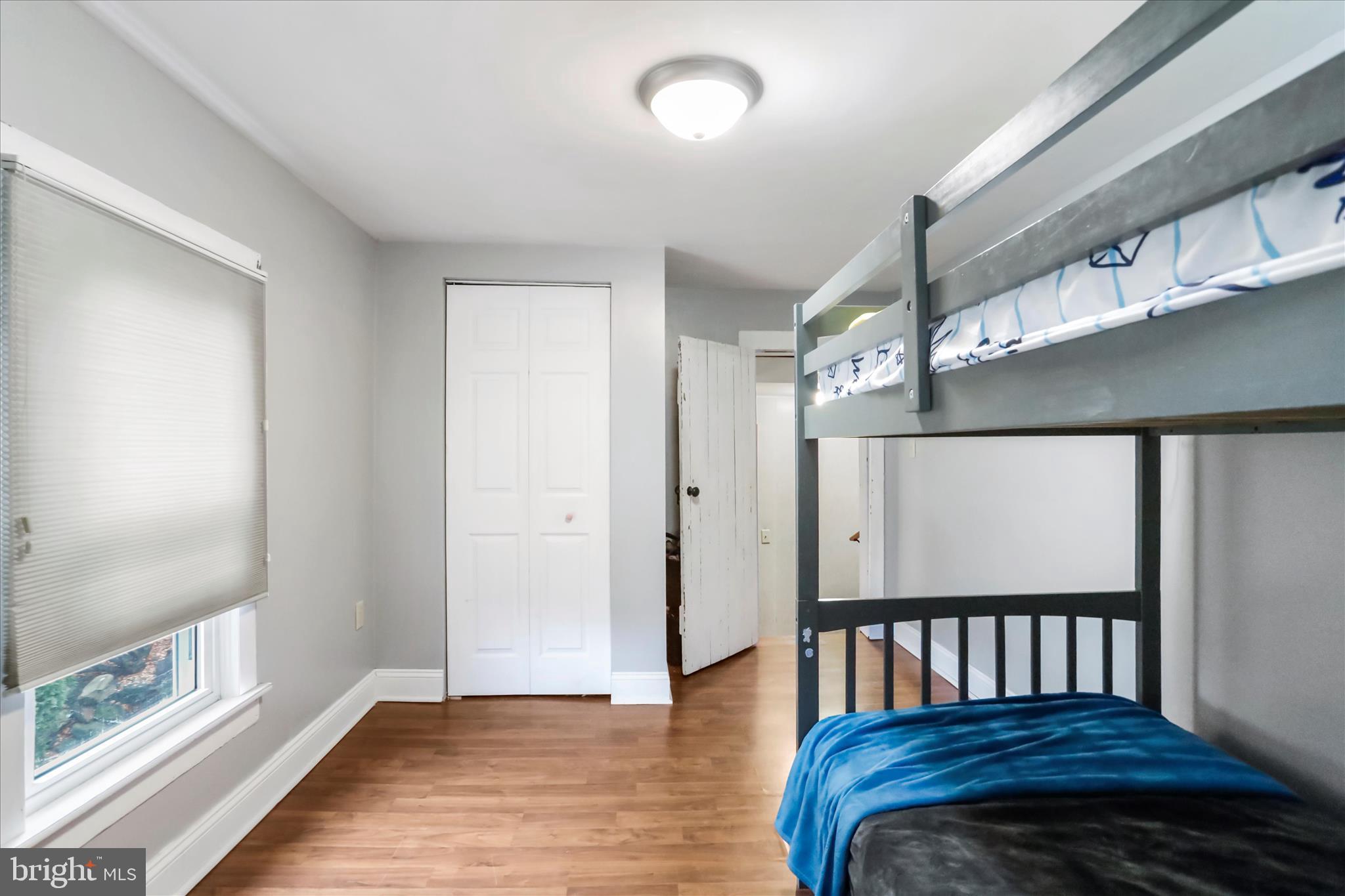 17211 Porter Road Southwest Frostburg, MD 21532 - Photo 20 of 34 a spacious bedroom with a bed and wooden floor