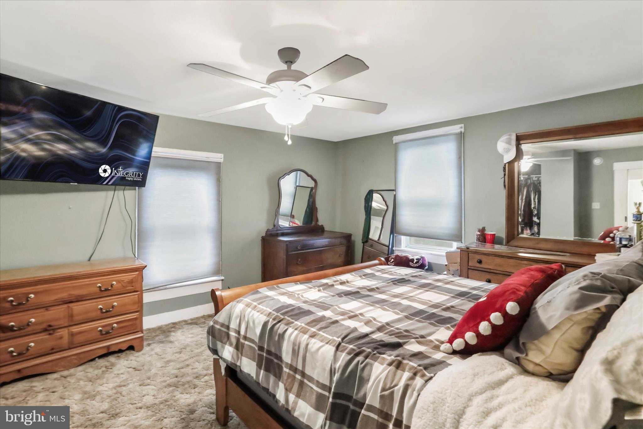 17211 Porter Road Southwest Frostburg, MD 21532 - Photo 23 of 34 a bedroom with a bed and a mirror on the dresser
