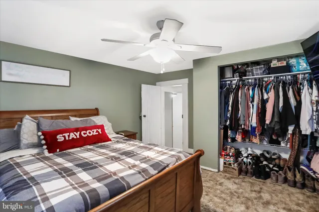 a bedroom with a bed and a closet