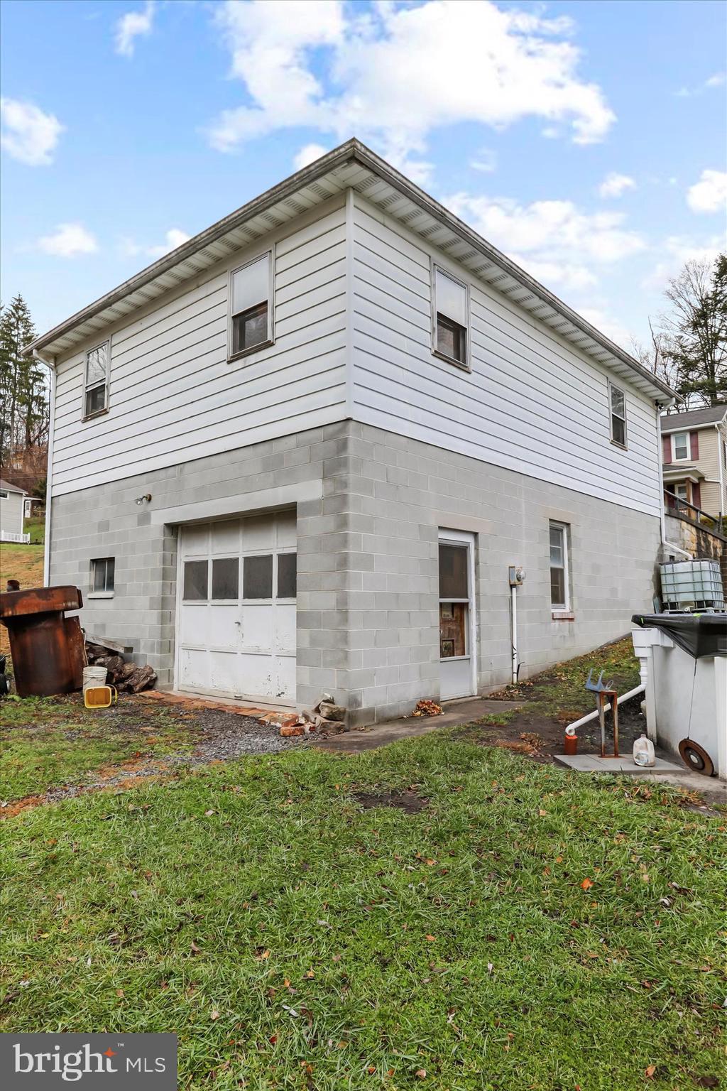 17211 Porter Road Southwest Frostburg, MD 21532 - Photo 30 of 34 a view of a backyard with table and chairs and a large tree