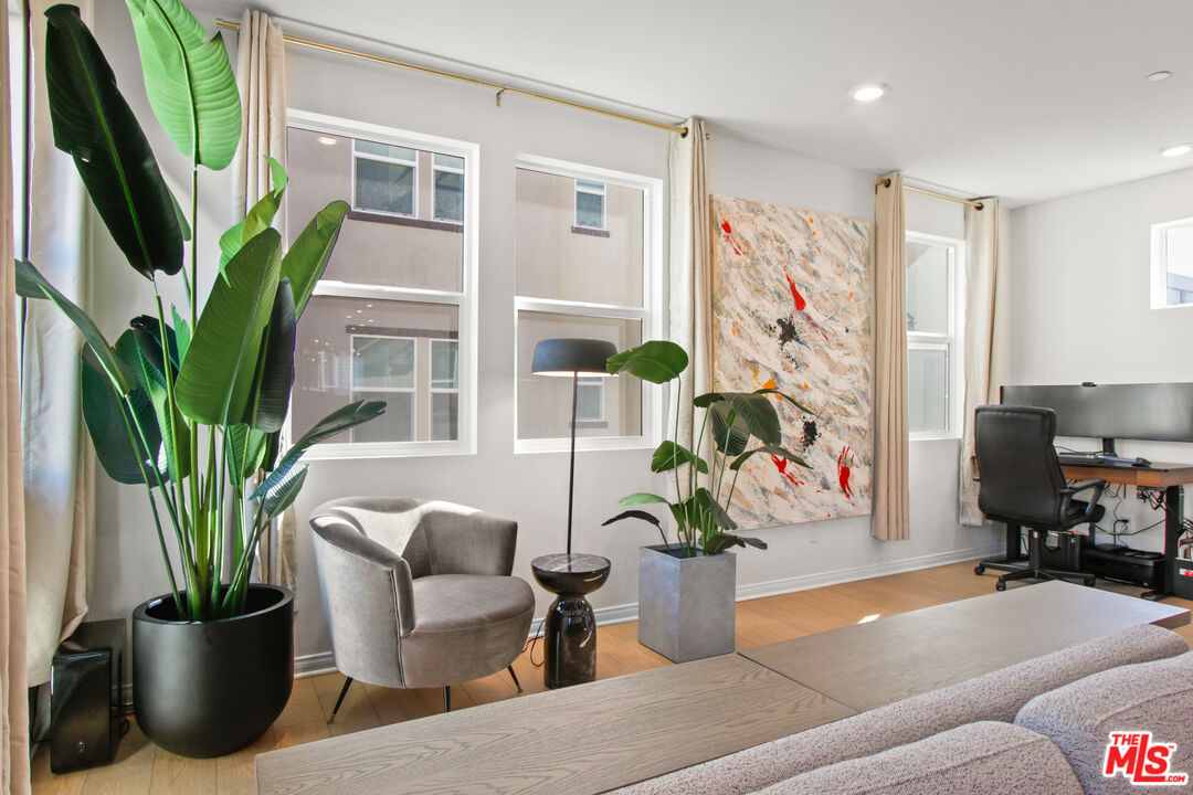764 Daniel Freeman Circle Inglewood, CA 90301 - Photo 12 of 35 a living room with furniture potted plant and a window