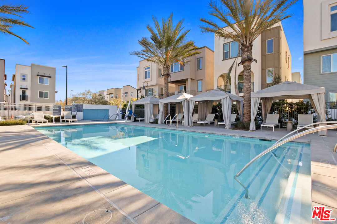 764 Daniel Freeman Circle Inglewood, CA 90301 - Photo 35 of 35 a view of a swimming pool with a lounge chairs