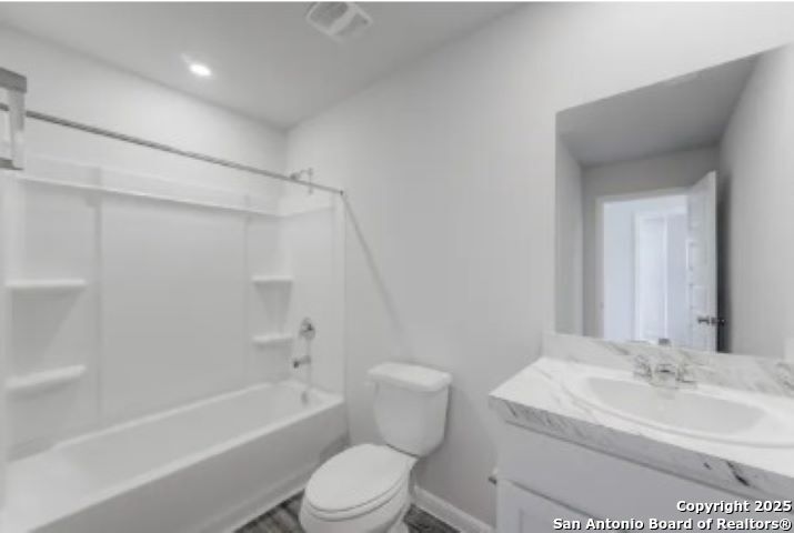 617 Cadena Loop Kenedy, TX 78119 - Photo 12 of 21 a bathroom with a toilet a sink and bathtub