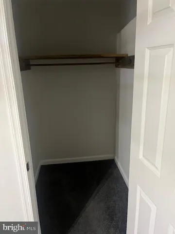 a bathroom with a toilet a sink and a window