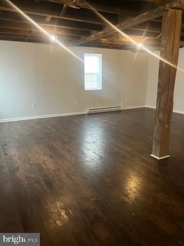 a kitchen with granite countertop a sink and a stove top oven