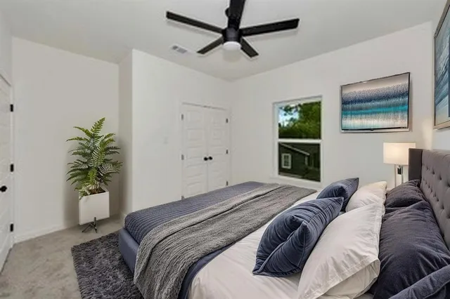 a bathroom with a toilet sink and shower