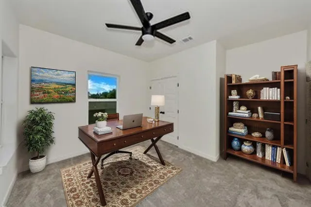 a kitchen with a stove a sink and a refrigerator