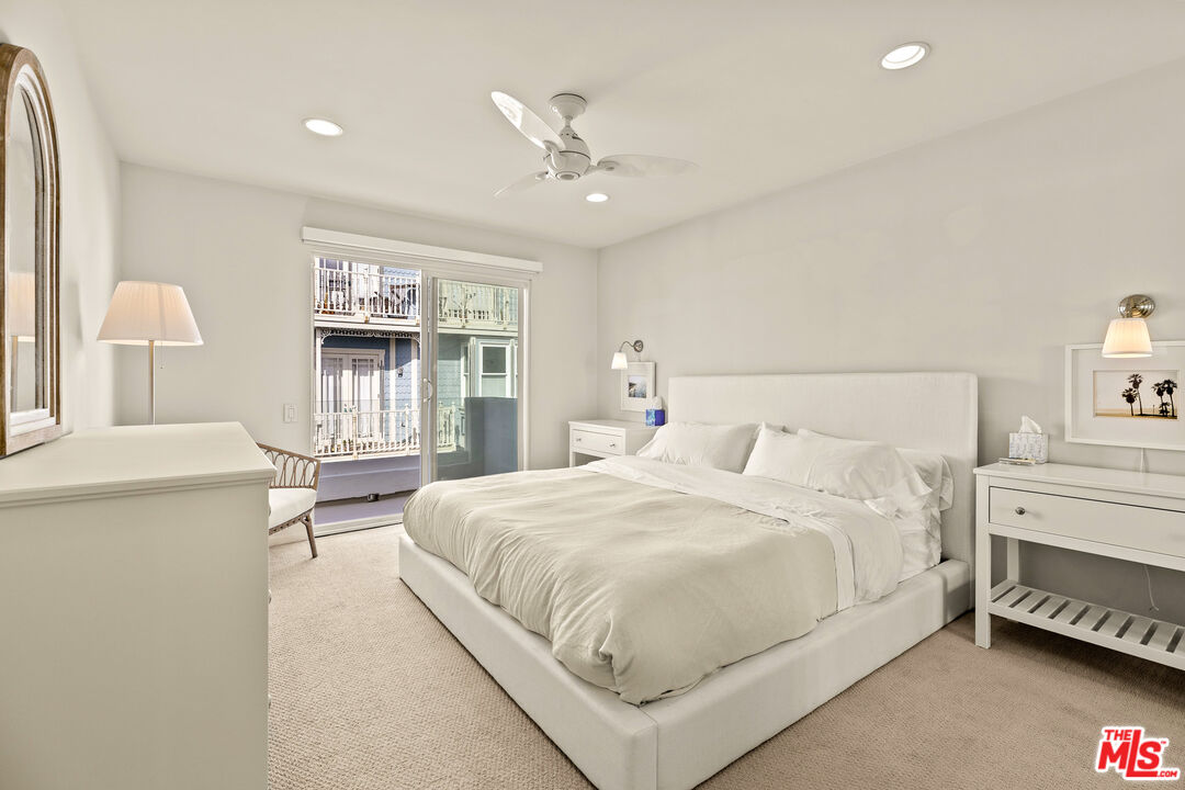 3616 The Strand, Unit C Manhattan Beach, CA 90266 - Photo 26 of 34 a bedroom with a large bed and a window