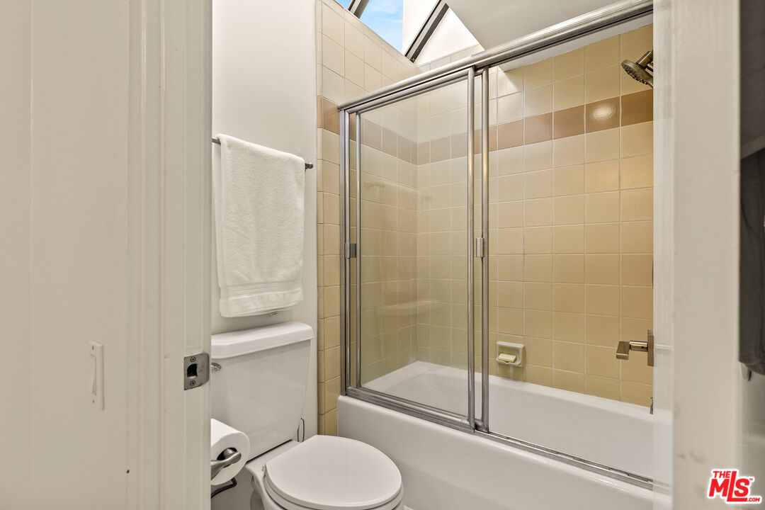 3616 The Strand, Unit C Manhattan Beach, CA 90266 - Photo 30 of 34 a bathroom with a shower and toilet