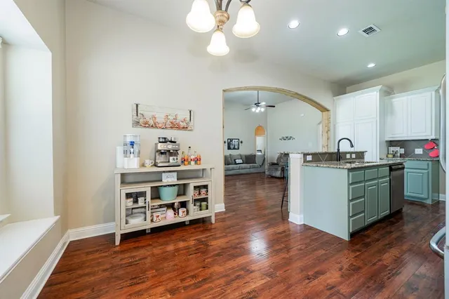 a view of kitchen with sink and cabinets