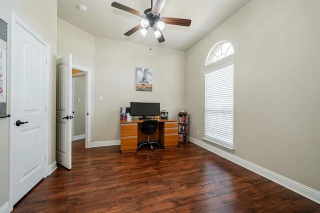 a view of a livingroom with furniture and a window