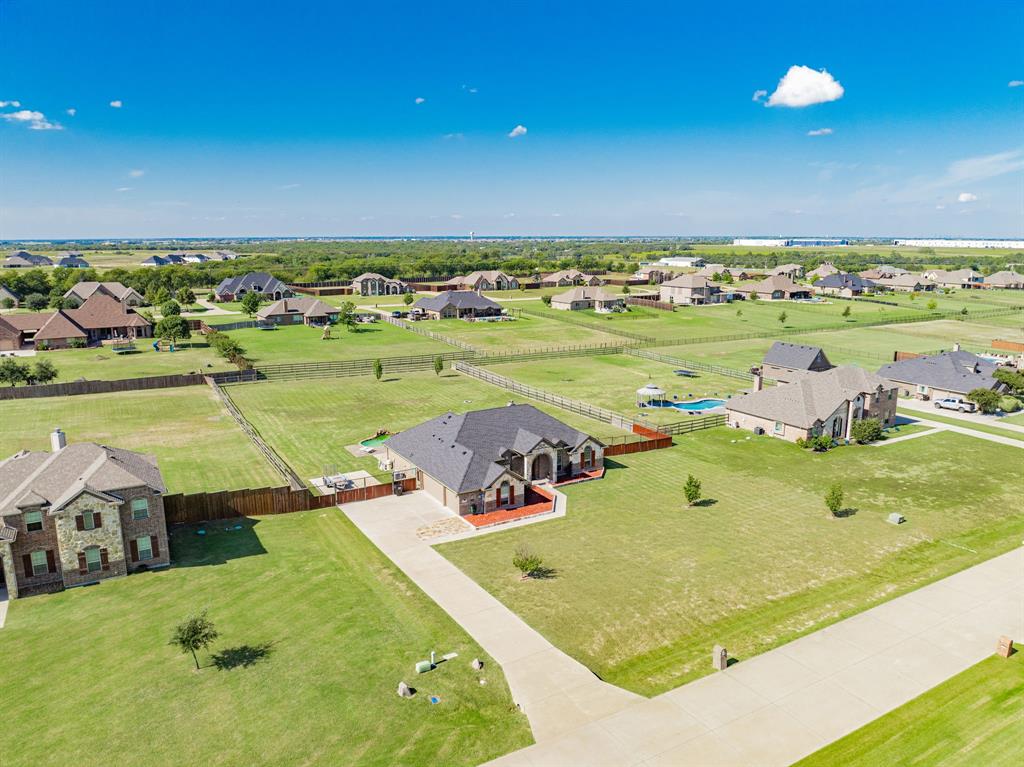 14176 Paterson Road Talty, TX 75126 - Photo 2 of 40 an aerial view of a house with a swimming pool