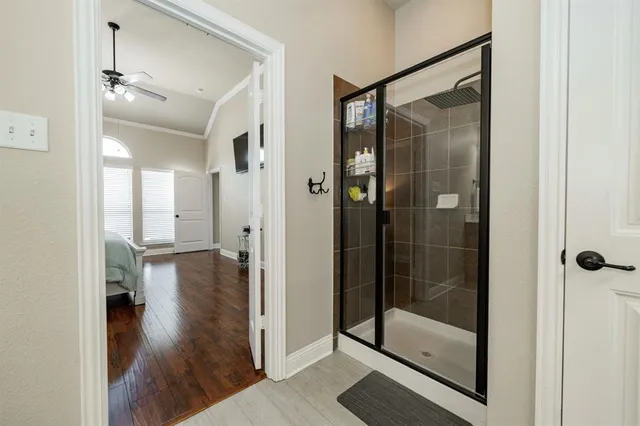 a bathroom with a glass shower door