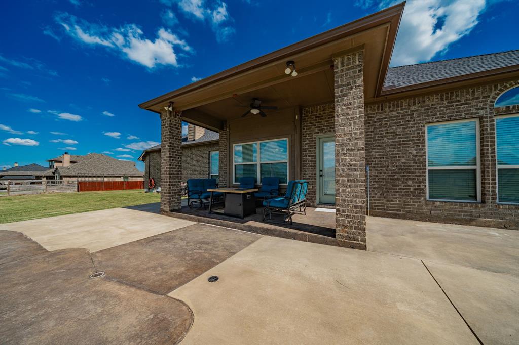 14176 Paterson Road Talty, TX 75126 - Photo 30 of 40 a view of a house with backyard and porch