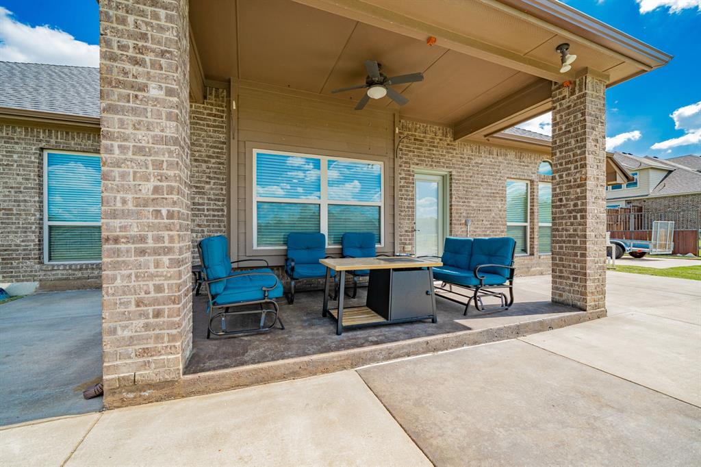 14176 Paterson Road Talty, TX 75126 - Photo 31 of 40 a view of a patio with a table and chairs