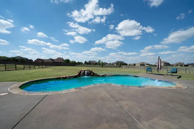 a view of a golf course with an ocean