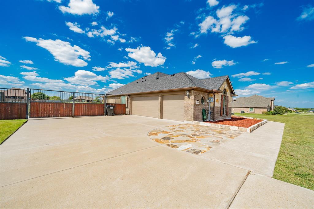 14176 Paterson Road Talty, TX 75126 - Photo 34 of 40 a view of a house with basketball court
