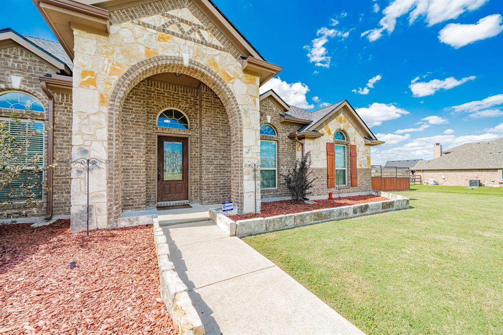 14176 Paterson Road Talty, TX 75126 - Photo 35 of 40 a front view of a house with a yard