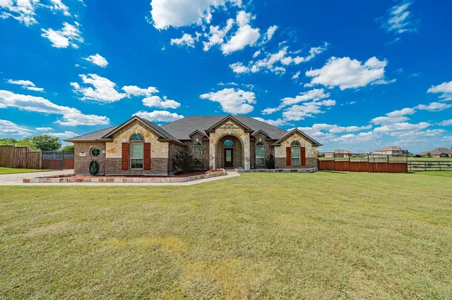 a front view of a house with swimming pool