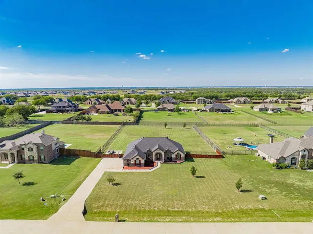 a view of a swimming pool and a yard