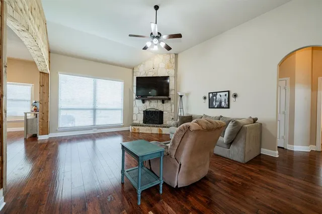 a living room with furniture fireplace and flat screen tv
