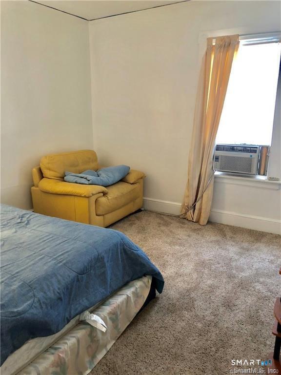 110 Beaver Street Ansonia, CT 06401 - Photo 19 of 31 a bedroom with a bed and a window