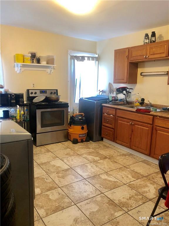 110 Beaver Street Ansonia, CT 06401 - Photo 23 of 31 a kitchen with a stove and a sink