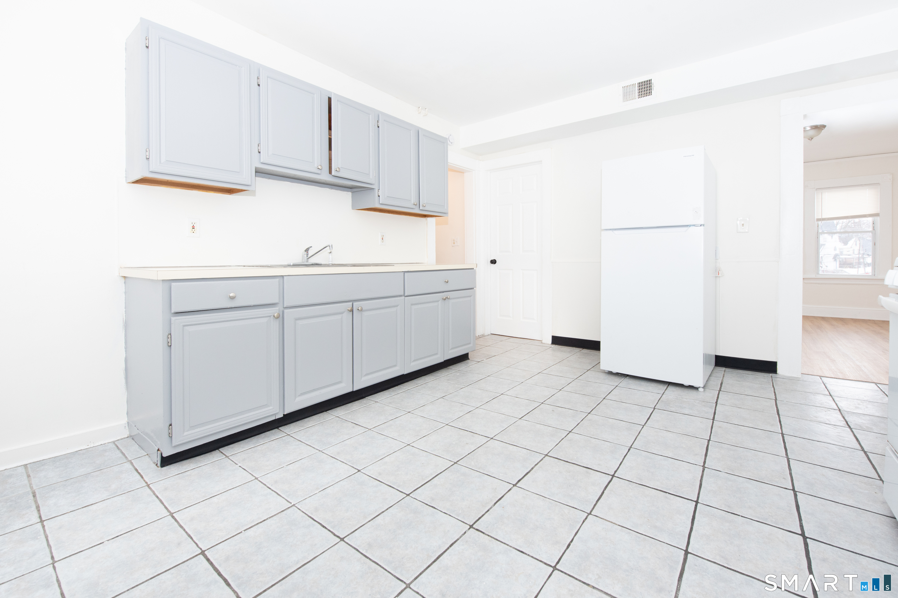110 Beaver Street Ansonia, CT 06401 - Photo 2 of 31 a kitchen with cabinets and white appliances