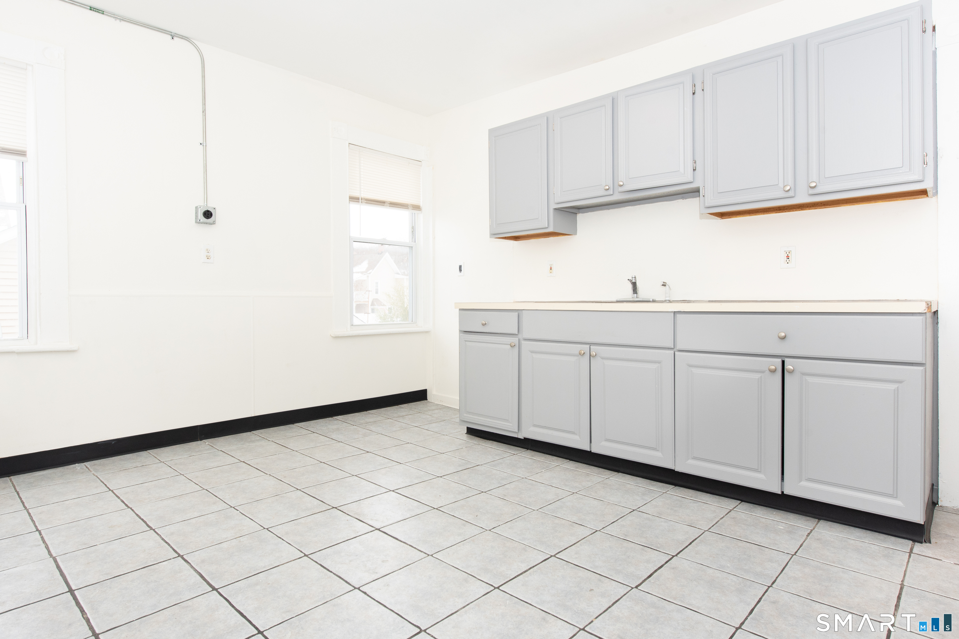 110 Beaver Street Ansonia, CT 06401 - Photo 4 of 31 a kitchen with white cabinets