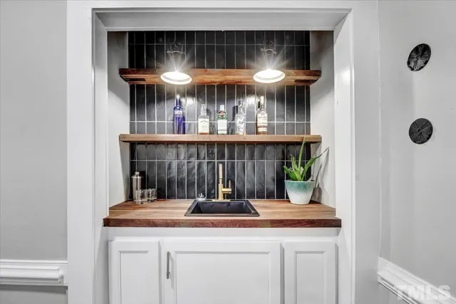 a kitchen with a sink and a refrigerator