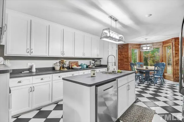 a kitchen with sink cabinets and window