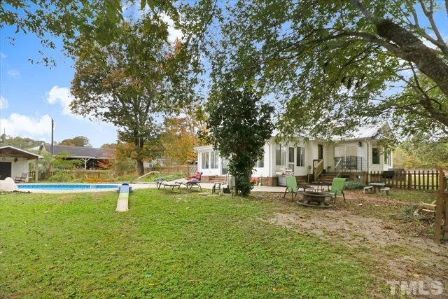 a view of a house with a back yard
