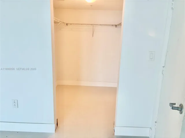 an empty room with sliding door