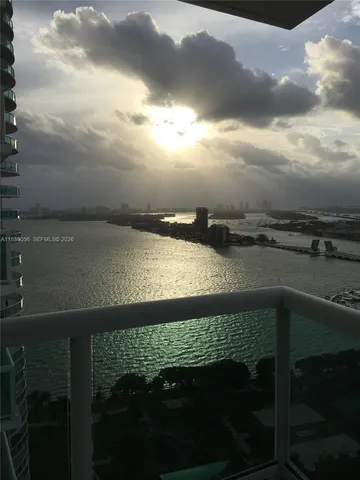a view of a garden with a building in the background