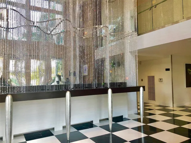 a living room with a black white checkered floor with a black white checkered floor
