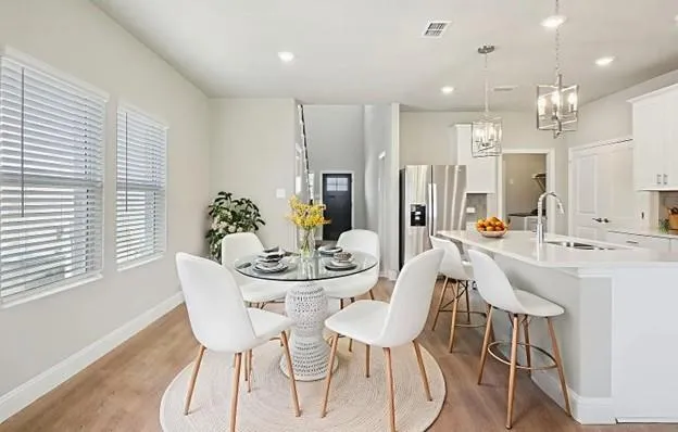 a view of a dining room with furniture and window