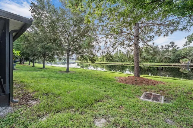 a view of a garden with a lake view