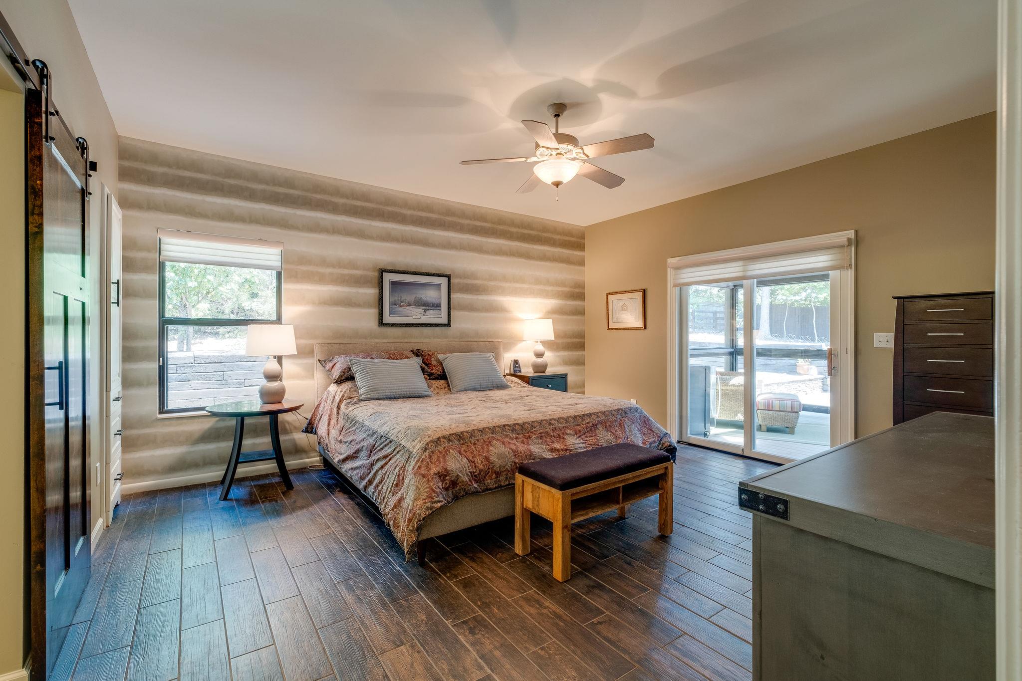 4766 Murfreesboro Road Arrington, TN 37014 - Photo 14 of 30 Main Level OWNERS SUITE privately situated away from other living areas of home. Large Windows provide ample natural lighting and 12'x6' LARGE WALK-IN CLOSET, Sliding BARN DOOR to OWNERS BATH RETREAT.